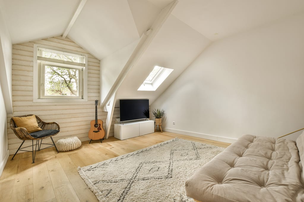 Transforming Spaces: The Rise of Loft Conversions in Hammersmith 5 Transforming Spaces: The Rise of Loft Conversions in Hammersmith a living room with a couch and a tv 2025 02 10 00 18 07 utc