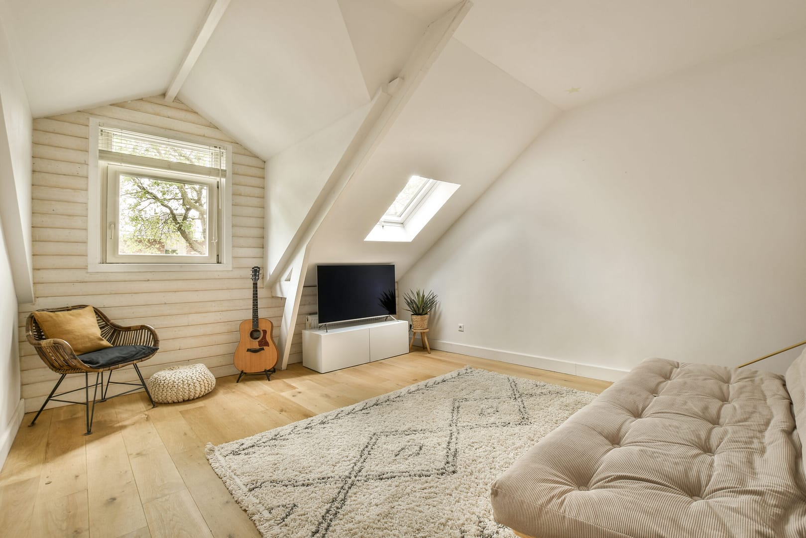 a living room with a couch and a tv