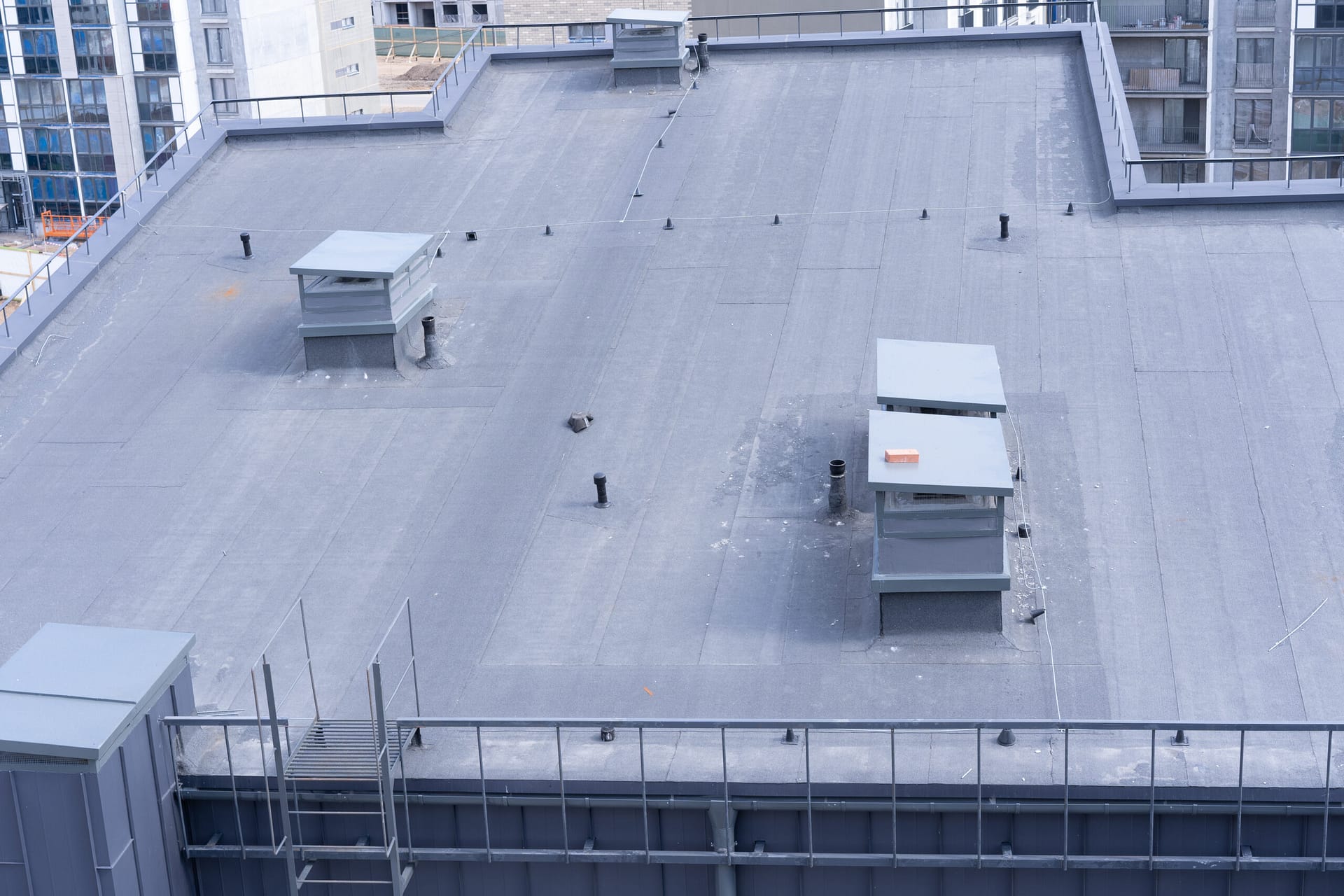 top view of the roof structure of an apartment building Services iStock 1142829591 scaled