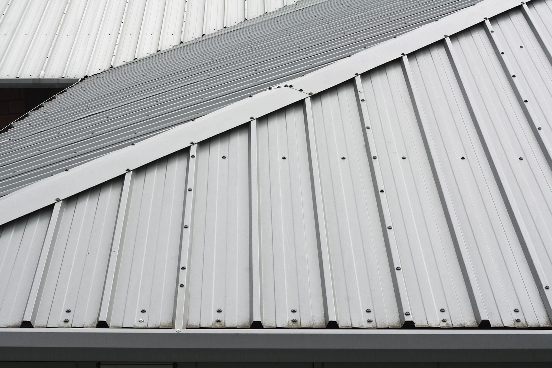 A metal roof that has a small slant to it