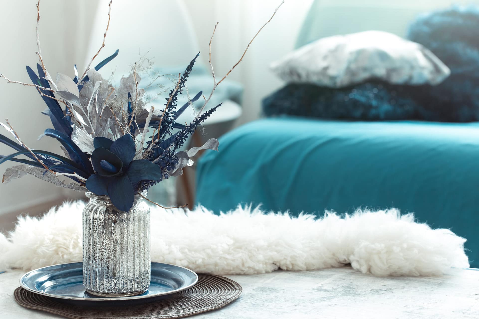 Still life vase with artificial flowers in the living room.
