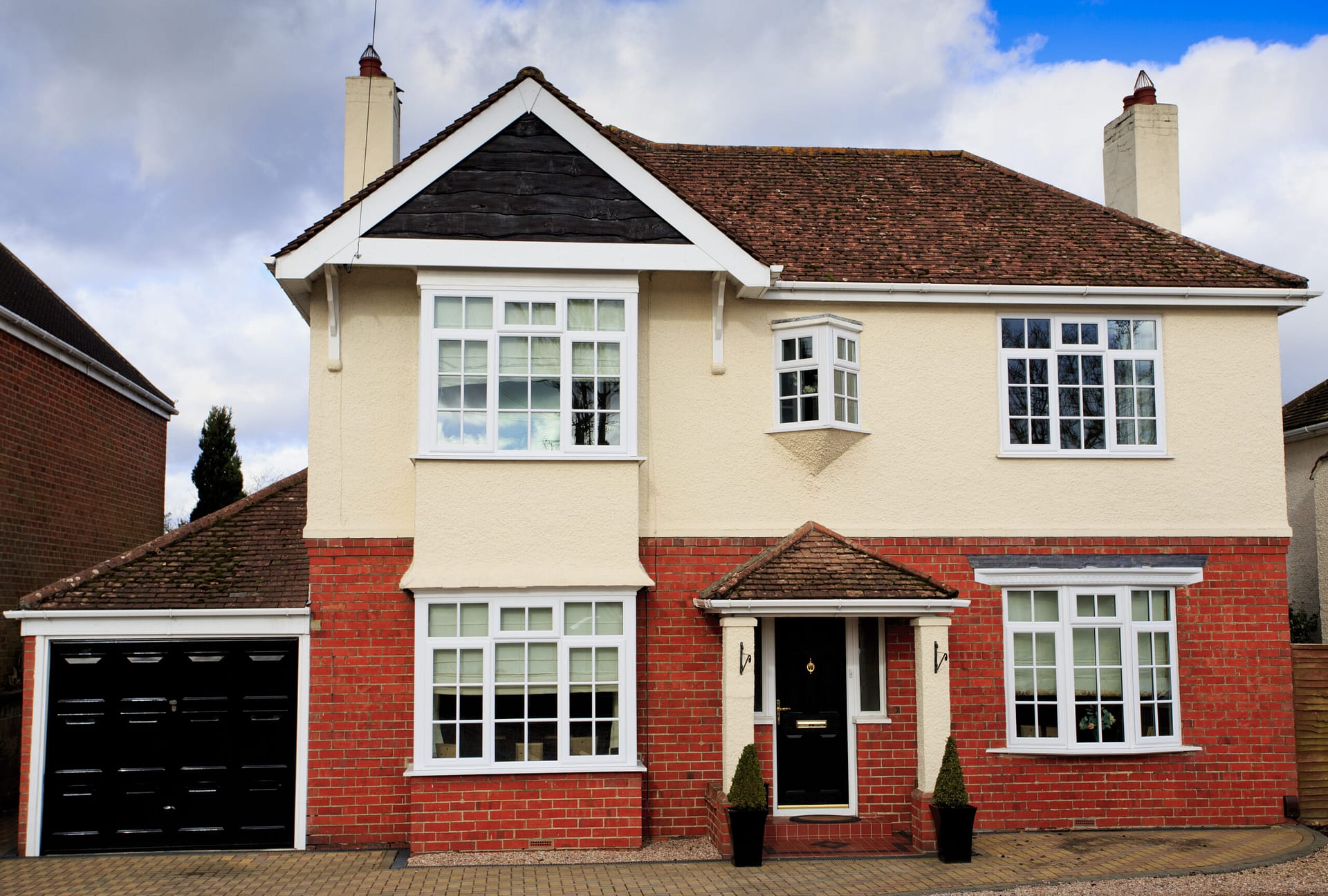 Large brick and rendered detached house